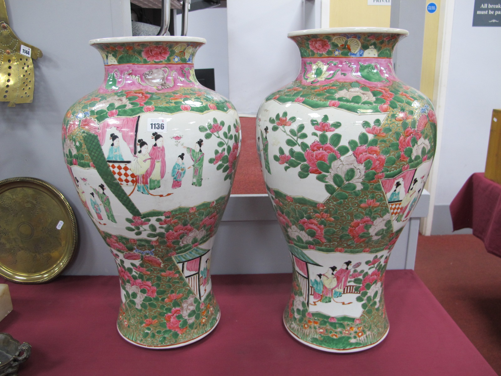 A Pair of Chinese Famille Rose Porcelain Vases, the panels decorated with female figures with