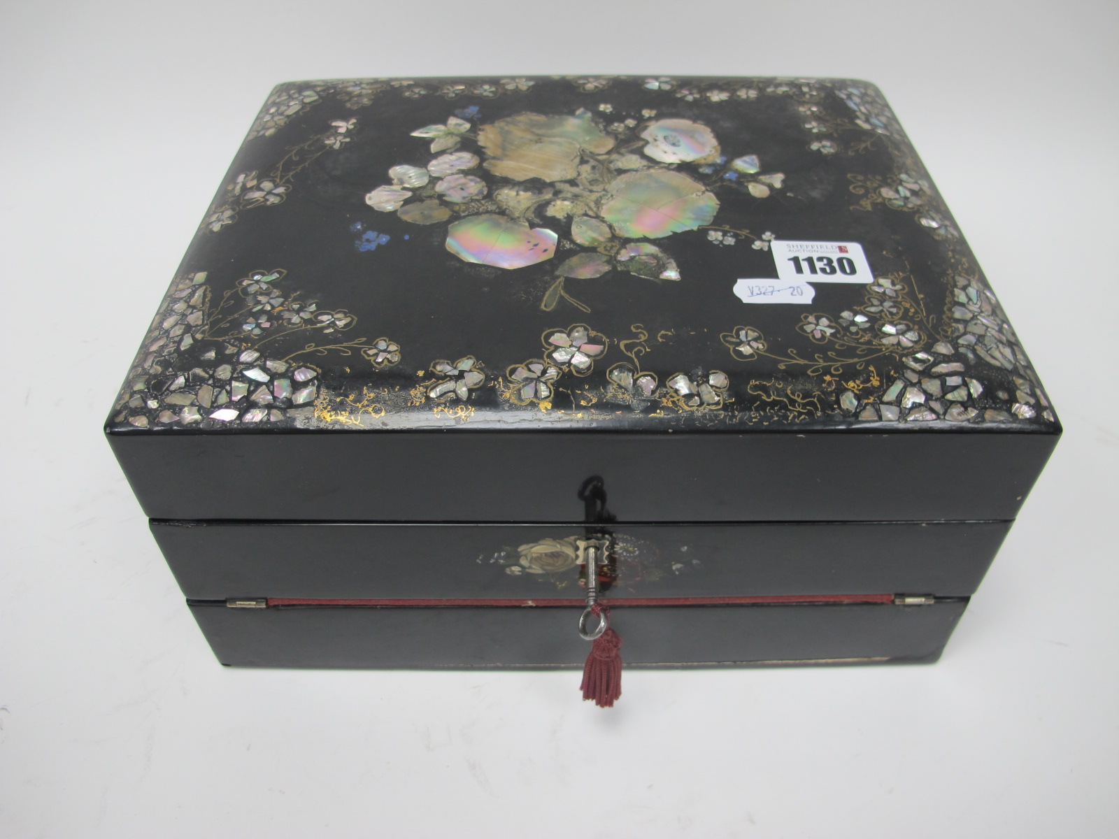 A Mid XIX century Black Lacquered Writing Box, with mother of pearl inset decoration to the lid, the