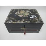 A Mid XIX century Black Lacquered Writing Box, with mother of pearl inset decoration to the lid, the
