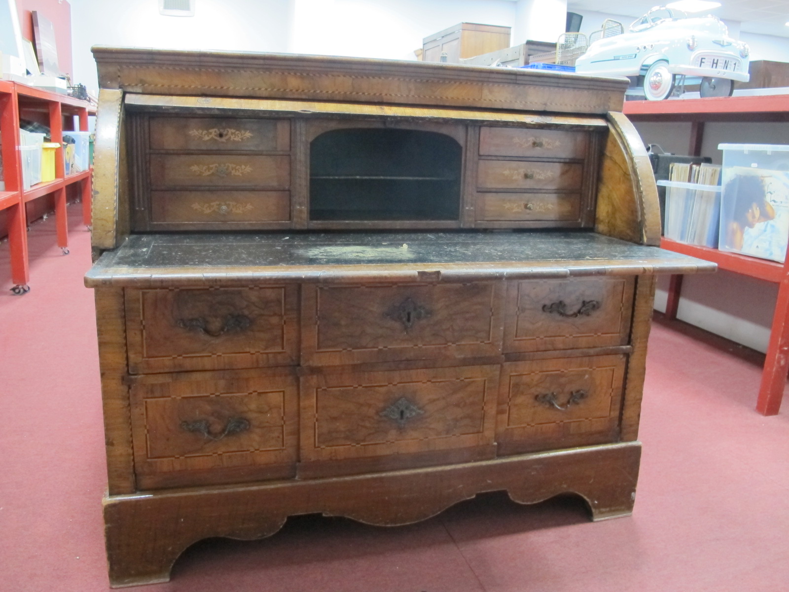A XVIII Century Continental Walnut Cylinder Writing Desk, with a crossbanded top, cylinder fall,