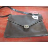 A Vintage Christian Dior Brown Leather Handbag, of envelope style with gilt logo clasp and flat