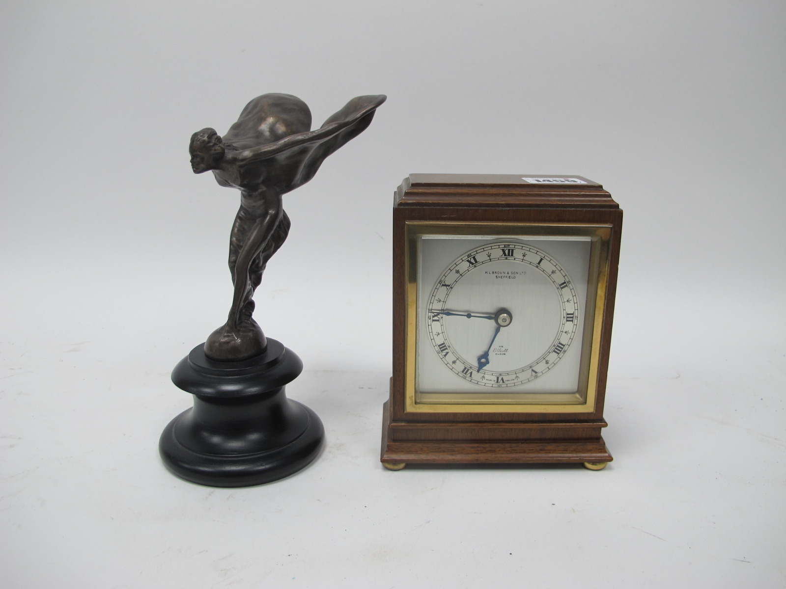 An Elliott Clock, retailed by H.L. Brown and Son Ltd., Sheffield, in a rectangular mahogany case,