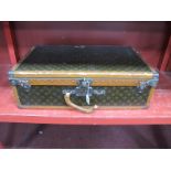 A Louis Vuitton Suitcase, with pull-out tray with straps, paper label numbered 802926, lock numbered