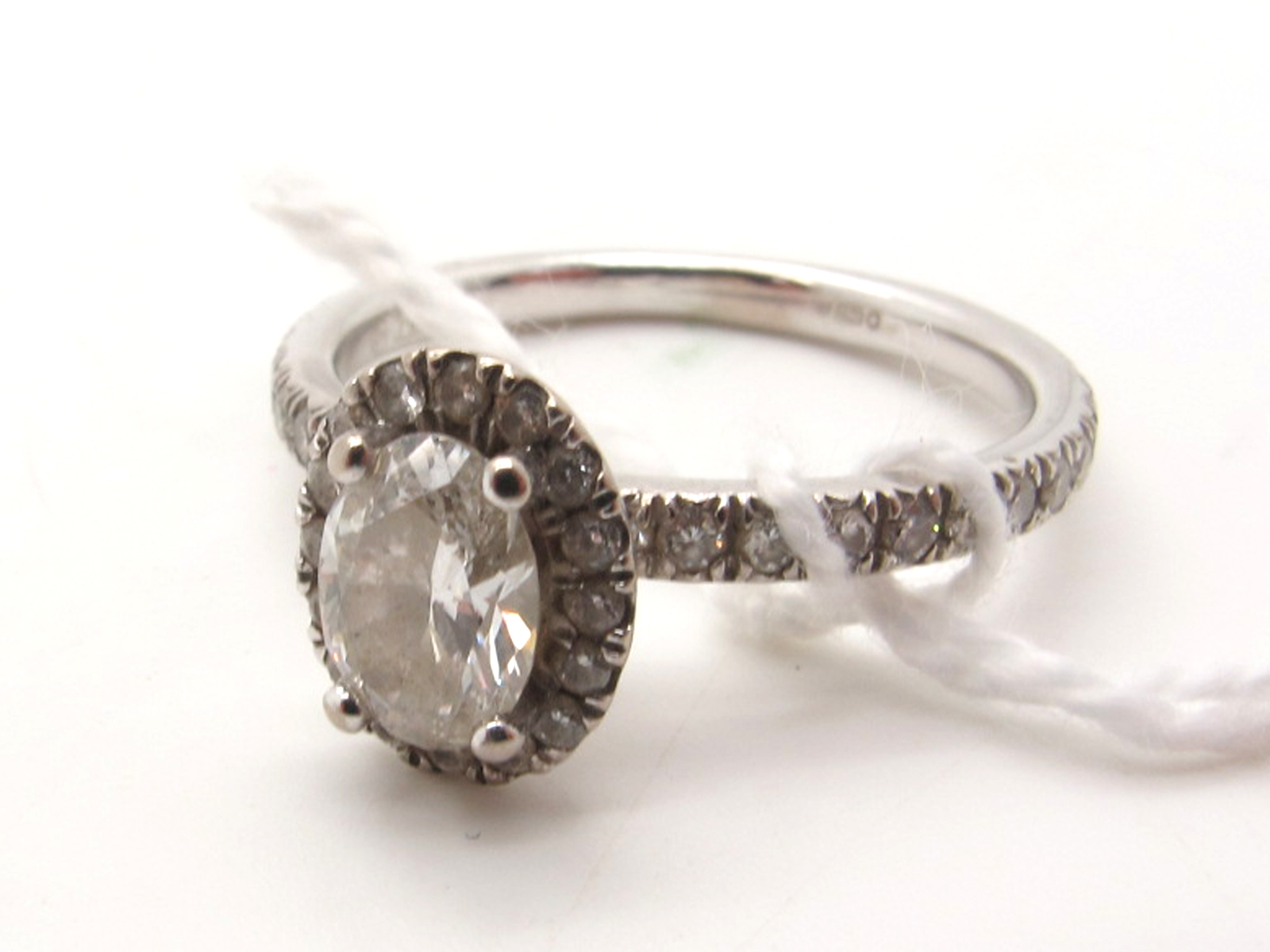 Beaverbrooks Maple Leaf Diamonds; A Modern 18ct White Gold Oval Cut Single Stone Diamond Halo