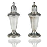 A PAIR OF EMPIRE SILVER SALT AND PEPPER SHAKERS
