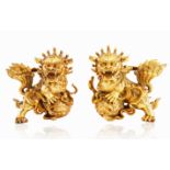 A PAIR OF CHINOISERIE GILT BRASS ORMOLU DOGS OF FOO