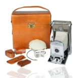 A VINTAGE POLAROID LAND CAMERA 700 WITH ORIGINAL LEATHER CASE AND ACCESSORIES