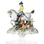 A MEISSEN PORCELAIN FIGURAL GROUP OF A HUNTER ON HORSEBACK WITH DOGS, LATE 19TH-EARLY 20TH CENTURY