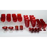 A GROUP OF THIRTY-SEVEN VINTAGE HAND-BLOWN ARTISANAL CRANBERRY RED GLASS STEMWARE