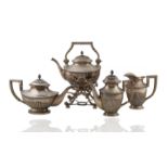 AN ANTIQUE FOUR PIECE SILVER SERVICE SET