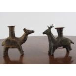 FOUR EARLY BRONZE CANDLE HOLDERS