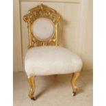 19TH-CENTURY CARVED GILTWOOD NURSING CHAIR