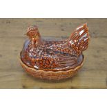 GLAZED POTTERY HEN ON NEST