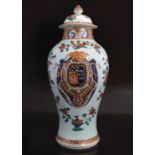 CHINESE QING PERIOD ARMORIAL FAMILLE ROSE VASE
