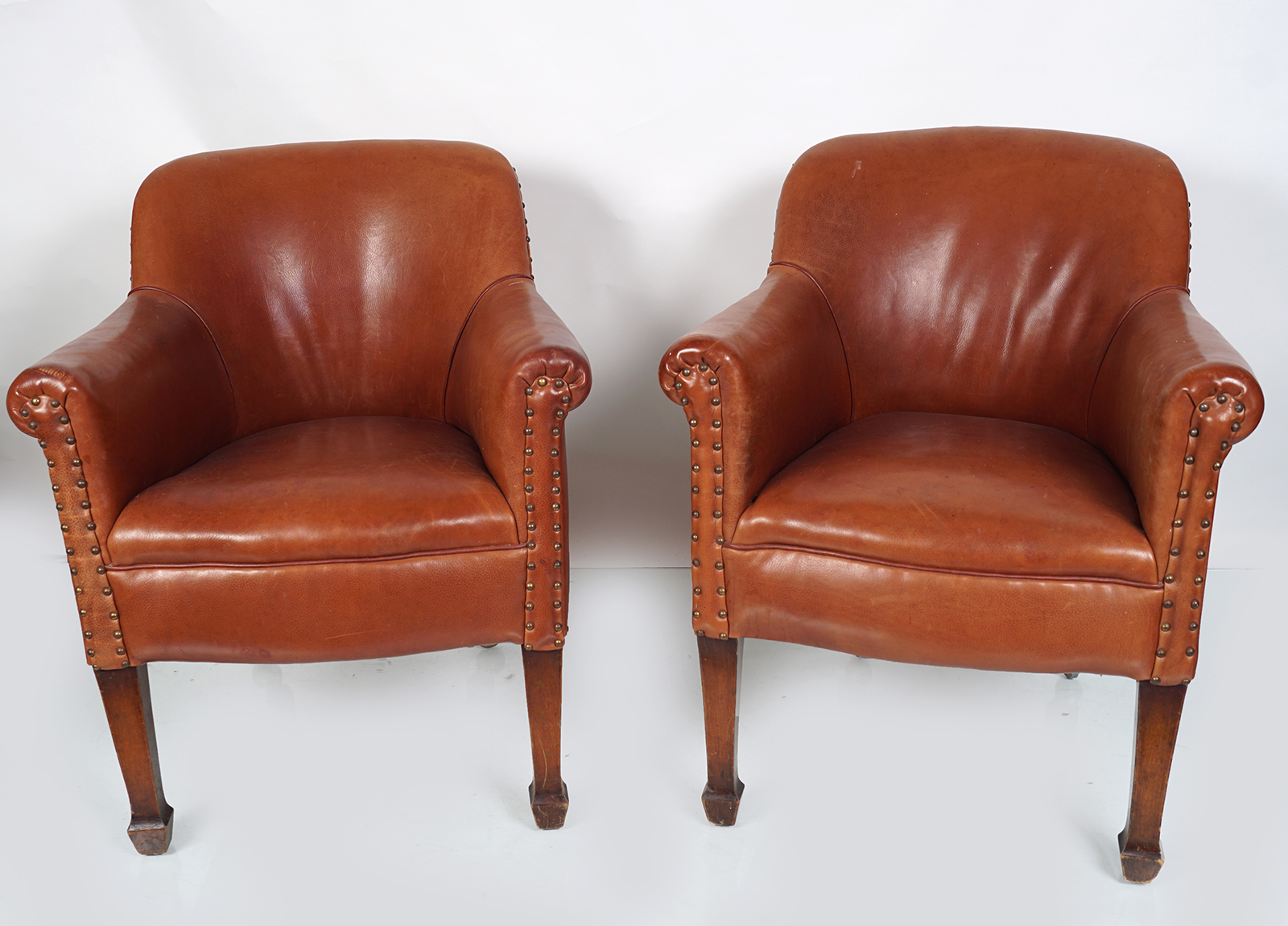 PAIR OF EDWARDIAN CHESNEAU LEATHER ARMCHAIRS