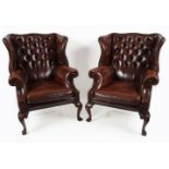 PAIR HIDE UPHOLSTERED WINGBACK ARMCHAIRS