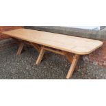 A large solid pine refectory style banqueting table on X frame supports, 320cm long x 88cm wide x