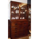 A 19th century mahogany secretaire bookcase with two glazed doors over associated base with