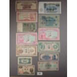 A wad of world banknotes including examples: British Arm Forces, Canada, Ceylon, China, Allied