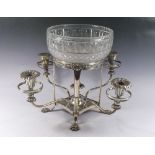 A silver plated large table centrepiece with four candle holders around central cut glass bowl (