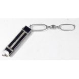 An Art Deco silver plated and black onyx pair of lorgnettes with spring action mechanism, 6cm length