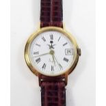 An 18 carat gold Asprey wrist watch with leather strap, cased