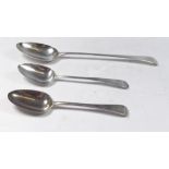 A Georgian silver basting spoon by William Sumner and Richard Crossley and two silver