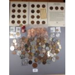A quantity of assorted British pre-decimal, decimal tokens and world coinage with 15