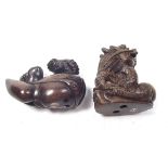 Two carved wood Japanese netsuke in the form of two toads on a gourd and a dragon