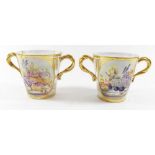 A pair of fine early 19th century porcelain cabinet cups painted oval reserves of flowers with fruit