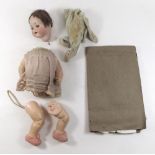 A school sewing sample booklet circa 1900 together with an antique doll (a/f) stamped Germany