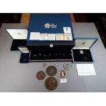 A quantity of miscellaneous Royal Mint coin cases empty apart from one case containing (2) £1