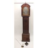 A 19th century mahogany cased longcase clock with arched top pediment over silvered dial with gilt