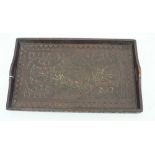 An antique carved tray with floral decoration 53cm x 32.5cm