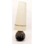 A West German pottery table lamp, 46m tall with cream shade