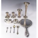 Two silver vases, a pair of silver candlesticks, a silver salt and mustard, silver and enamel