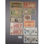 A wad of world banknotes including: (2) Bank of England 10 shillings prefix: 08A J.Q.Hollom and A94N