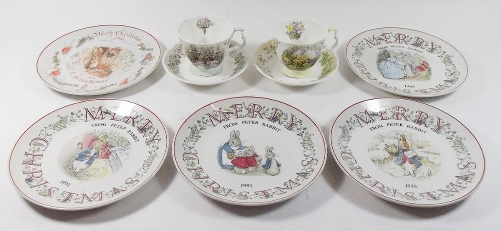 Five Wedgwood Peter Rabbit plates, a Royal Doulton Brambley Hedge Summer tea cup and saucer and a