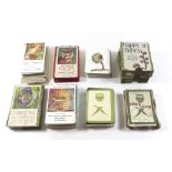 Four sets of Happy Families type playing cards