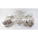 A selection of Paragon 'Country Lane' teaware comprising: two teapots, three teacups, seven saucers,