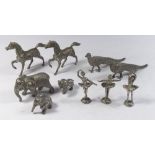 A quantity of silver plated figurines to include peacocks, horses, elephants and a set of