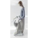 A Lladro figure woman with sheep and lamb, one finger a/f, 32cm high