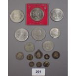 A group of coins including: (4) commemoratives, two shilling and half crown, USA half dollar and