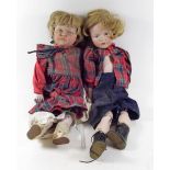 A pair of Kammer & Reinhart 'Kaiser' boy and girl dolls with bisque heads and composition bodies