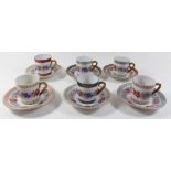 A Porcelaine de Couleuvre coffee set printed band of flowers comprising: six cups and saucers