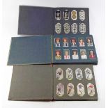 A cigarette card album including Ogdens Football club colours, Wills Aviation, Wills Naval Dress and