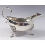 An Irish silver sauce boat on lion mask and paw supports, Dublin 1978, makers mark Alwright and