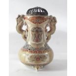 A Japanese Meiji period Satsuma vase with dragons to shoulders and pierced lid, 13cm high, signed to