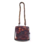 A faux tortoiseshell evening bag with mirror to interior