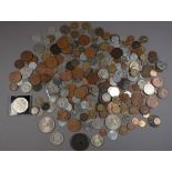 A quantity of world coins including: British decimal farthings, brass threepences, sixpences,